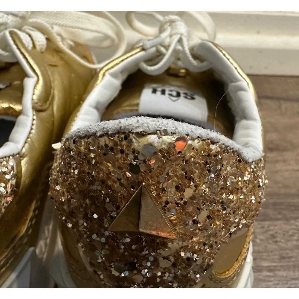 SCHUTZ ST-BOLD LEATHER SNEAKER in GOLD